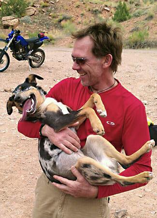 A man holding a dog